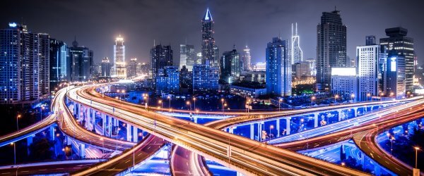 City office buildings and highway traffic motion blur