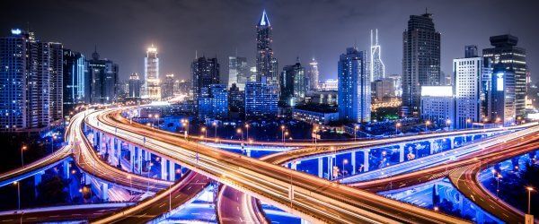 City office buildings and highway traffic motion blur